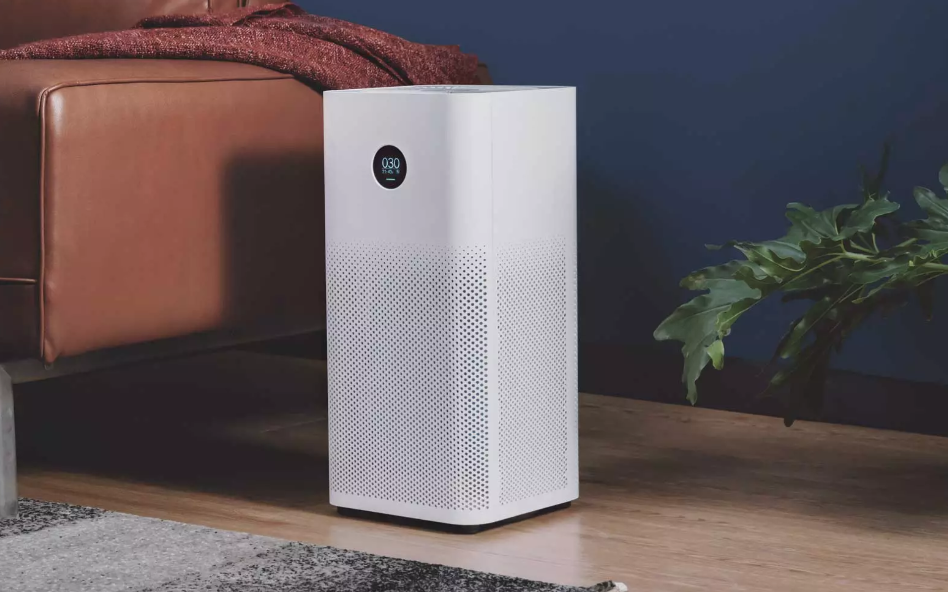 An air purifier running in a bedroom